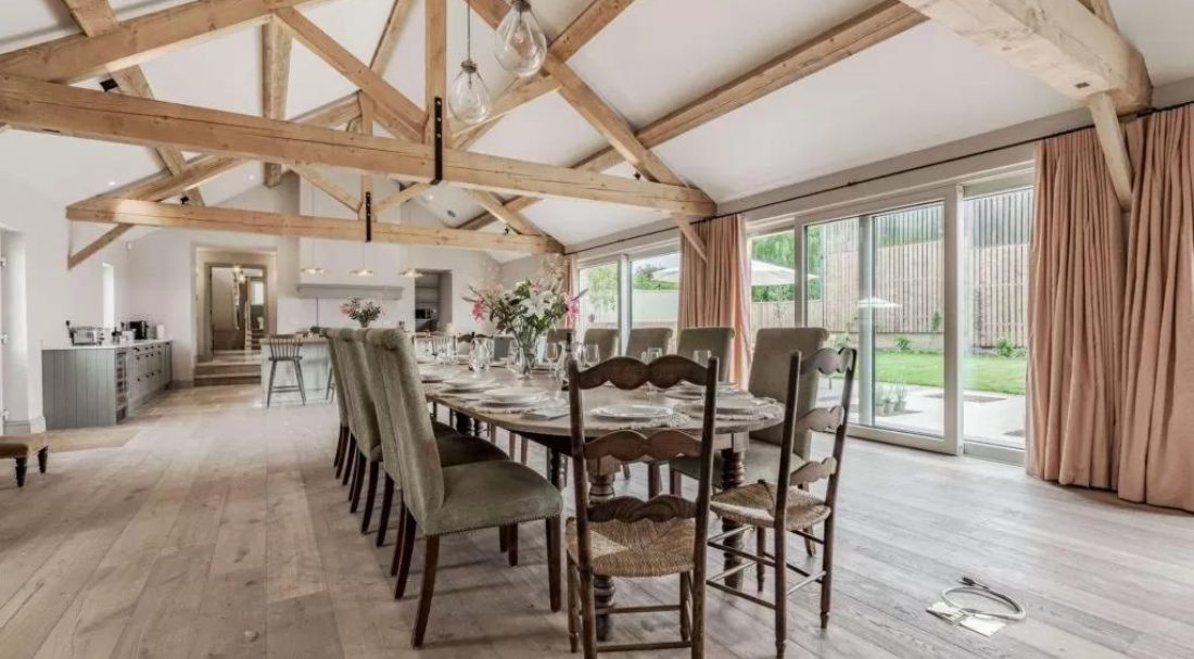 Open plan kitchen and dining room in a Cotswold holiday cottages for large groups