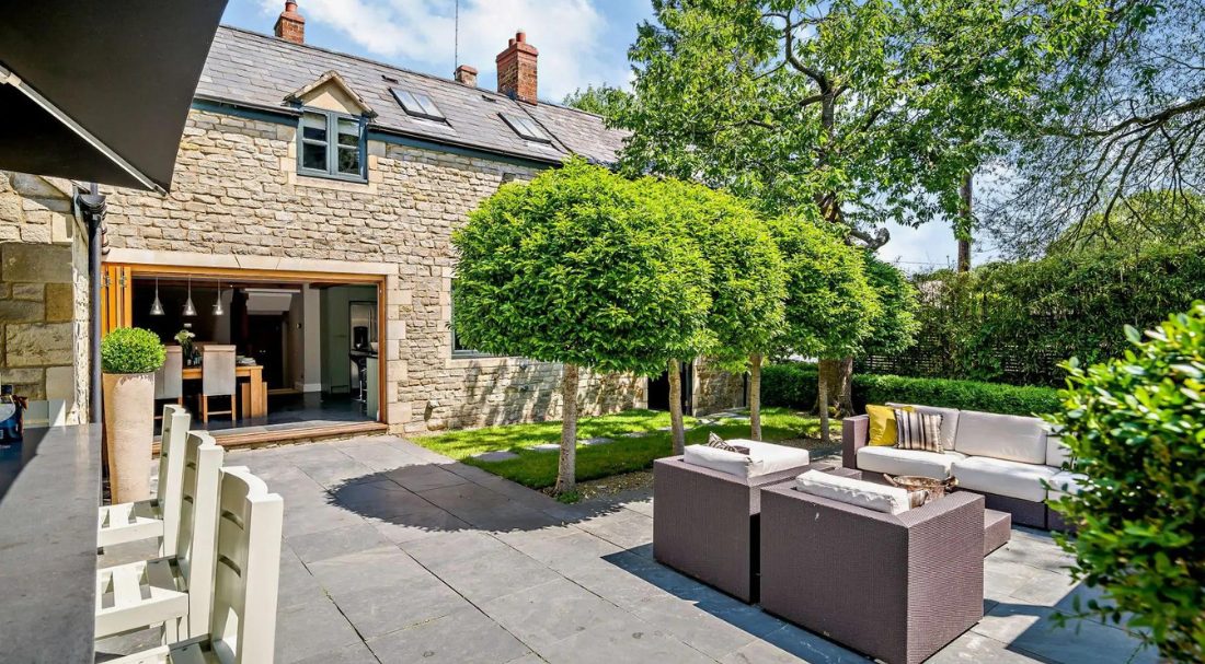 Beautiful outdoor seating in a stylish Cotswold home rental