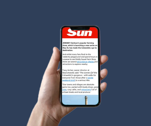 Mobile phone with StayCotswold news story on The Sun website