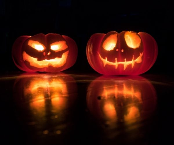 two carved and lit pumpkins
